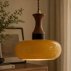 Nowoczesna drewniana lampa sufitowa z bursztynowym kloszem